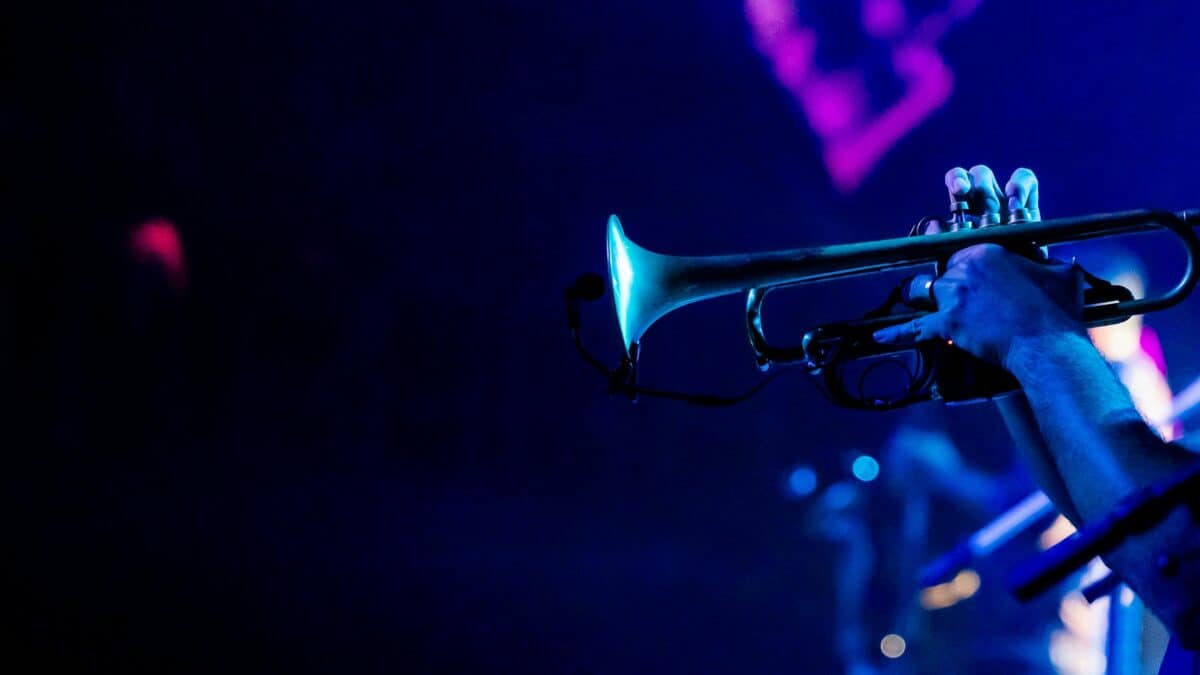 Jazz trumpeter performing live, evoking Louis Armstrong - the namesake of WordPress 7.0