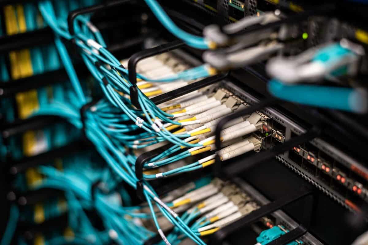 Fiber optic cables connected to server rack in data center
